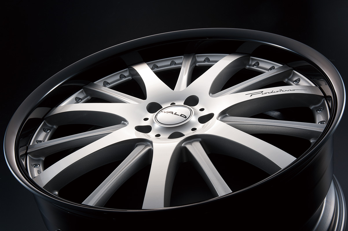Silver polished WALD Portofino P12C forged wheel with black alumite rim, studio angle view