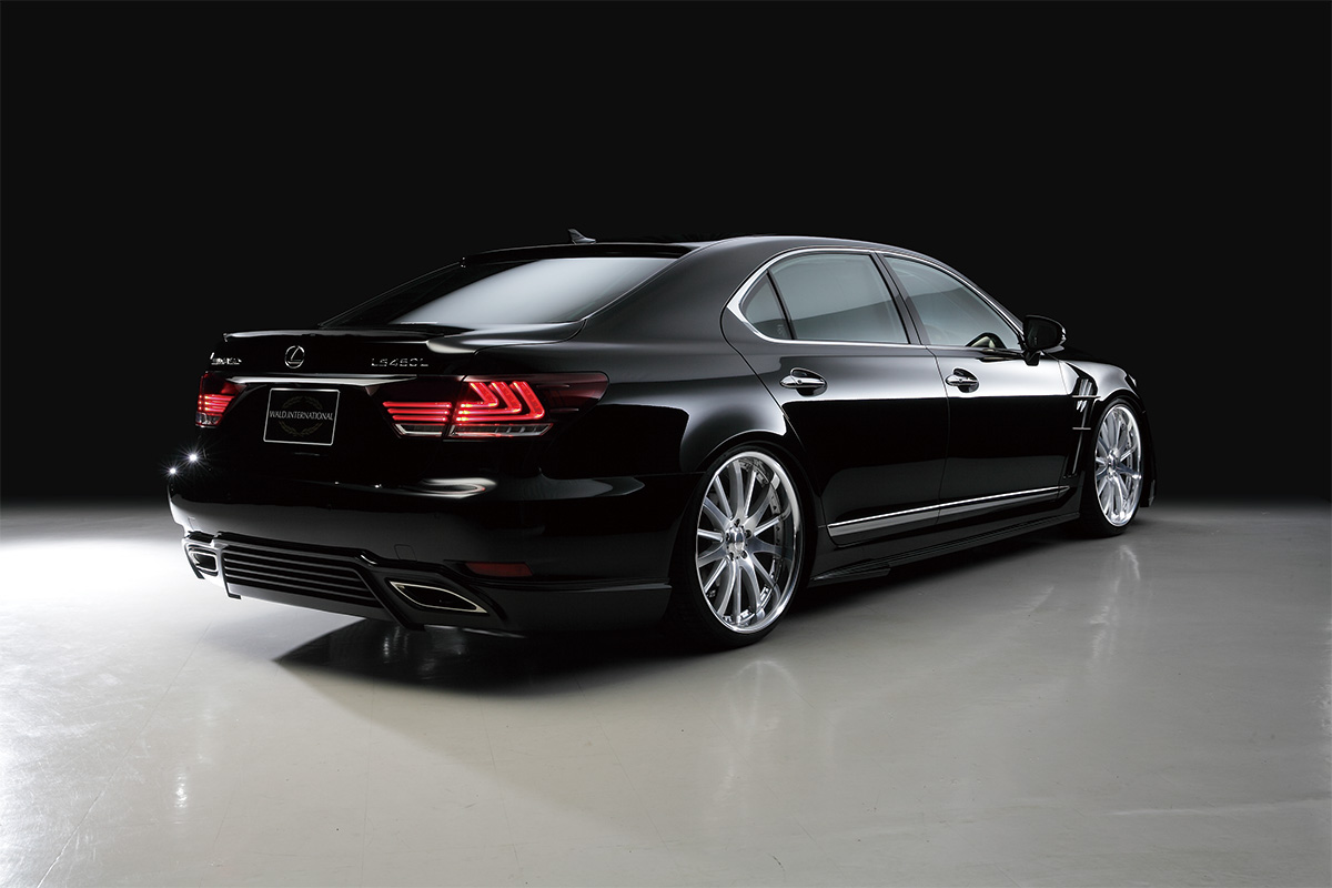 WALD Executive Line Lexus LS460L rear three-quarter studio view with WALD rear skirt, boot spoiler and exhaust finishers