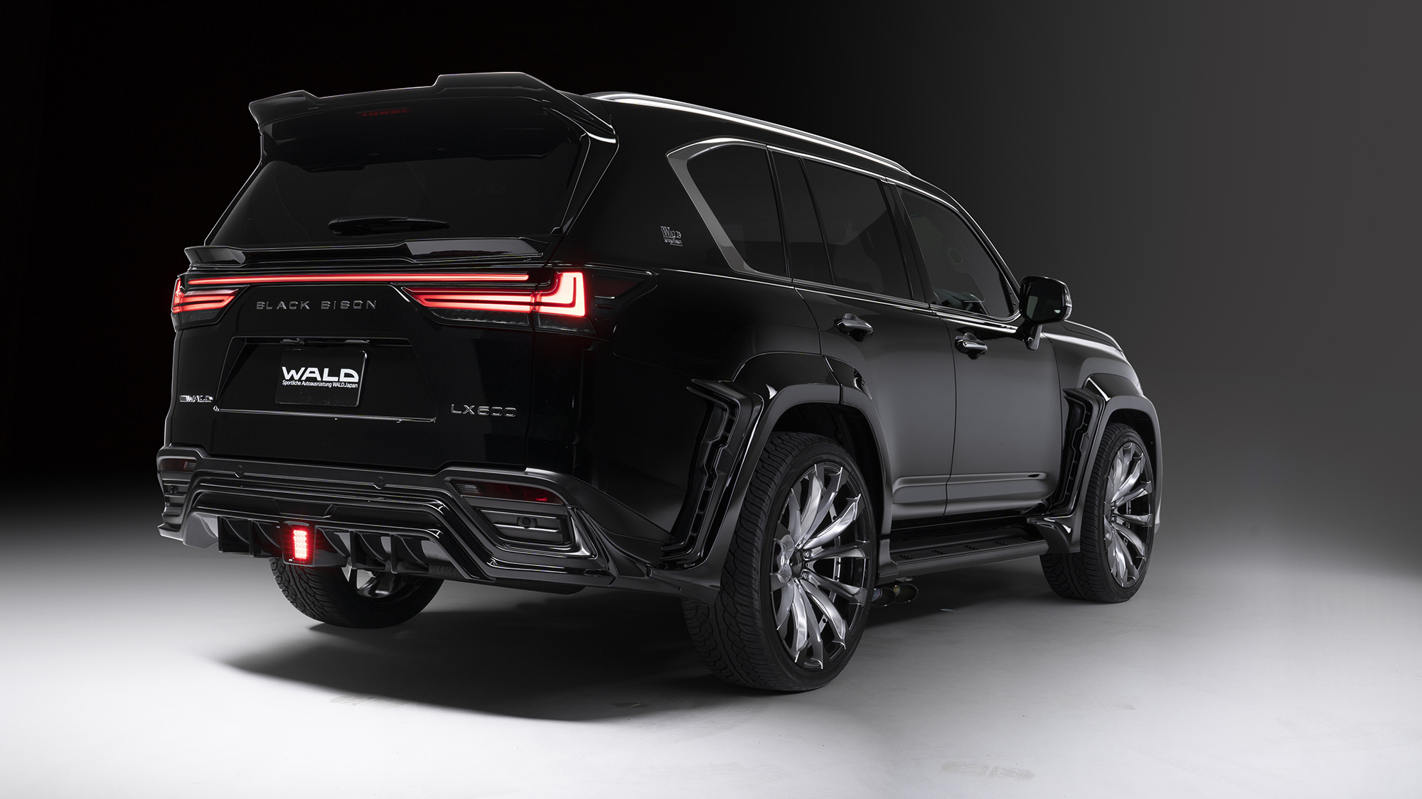 WALD Black Bison Lexus LX600 rear three-quarter view — WALD rear skirt, rear tailgate spoiler and rear roof spoiler