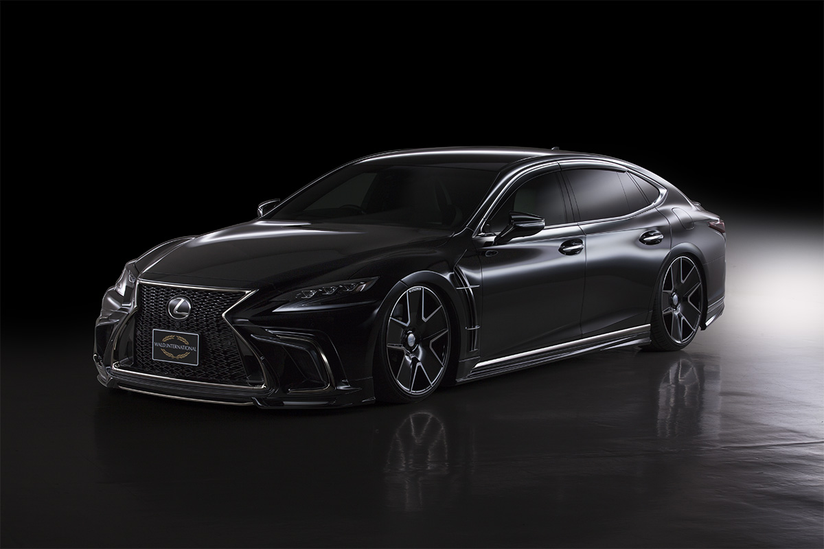 WALD Lexus LS500 F SPORT front three-quarter studio view with WALD add-on front spoiler and chrome accents