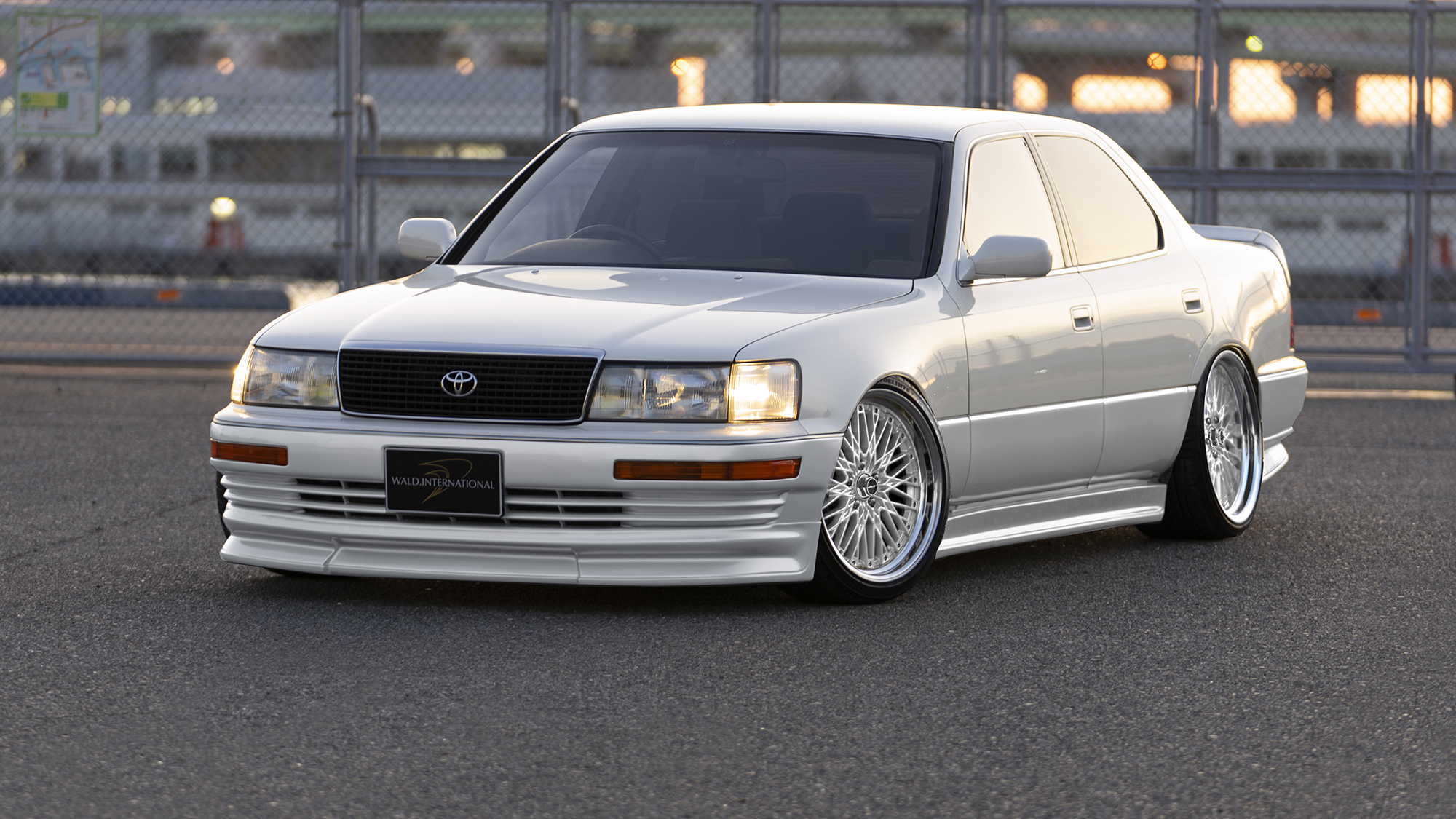 White Toyota Celsior with WALD body kit on silver WALD Classic Mesh CM12C wheels