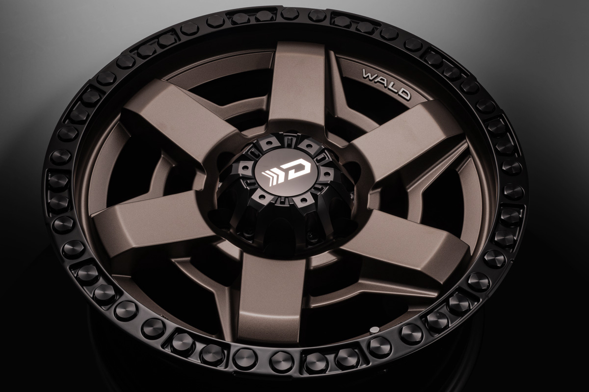 Overhead studio view of the WALD Desert Line DS001 in Matte Bronze Black