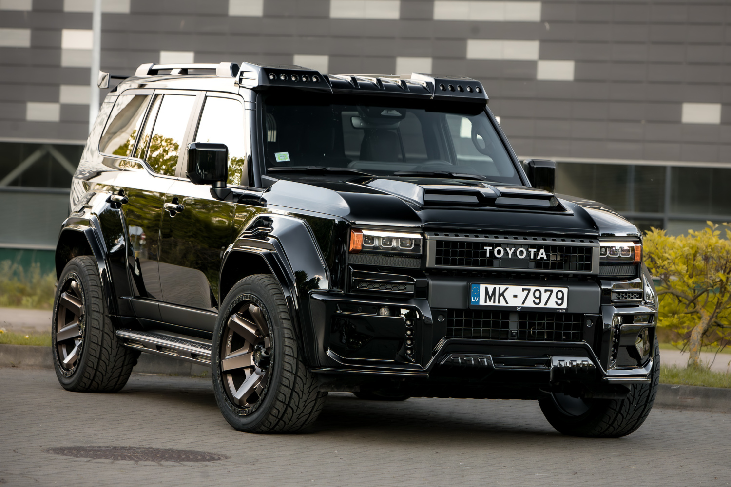 WALD Black Bison Toyota Land Cruiser 250 TRJ250W front three-quarter view with bonnet scoop cover and front roof spoiler