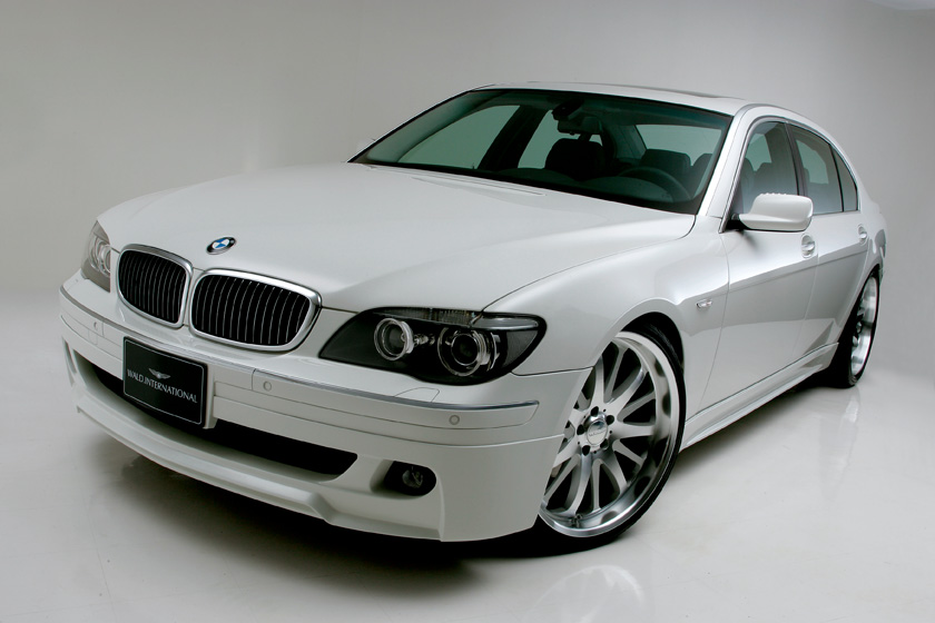 WALD BMW E65 Sports Line front three-quarter studio detail of white BMW 7 Series with WALD body kit and forged wheels