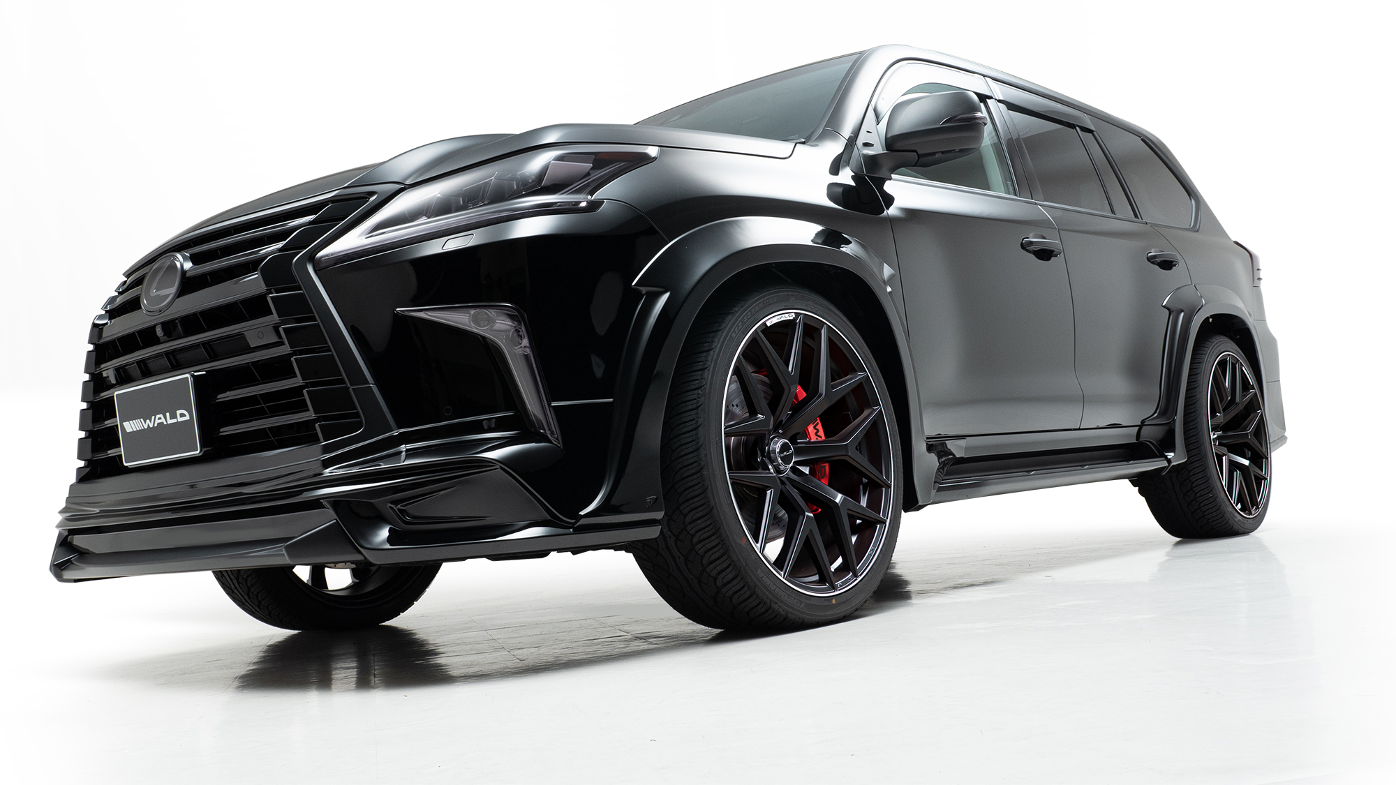 Black Lexus LX570 WALD Sports Line Black Bison on 24 inch WALD MB001 forged-look SUV wheels