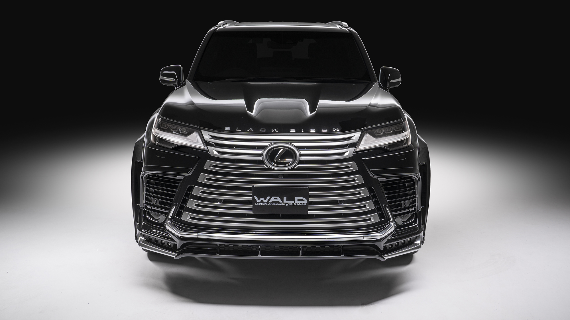 WALD Lexus LX600 body kit — head-on front view with WALD front spoiler, plated garnish set and wide arch package