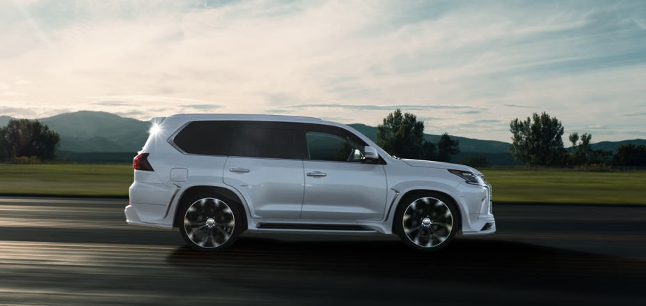 White WALD Lexus LX570 side profile in motion on WALD multi-spoke wheels