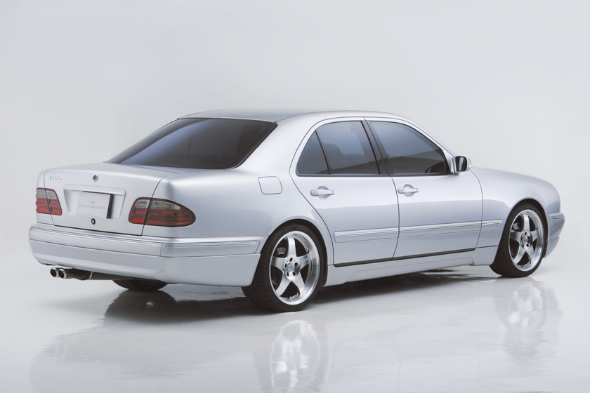 Mercedes-Benz E-Class W210 WALD Executive Line rear three-quarter studio view with rear skirt and twin exhaust