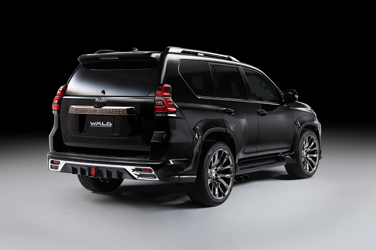 WALD Black Bison Edition Land Cruiser Prado 150 rear three-quarter studio view with rear bumper spoiler and chrome garnish