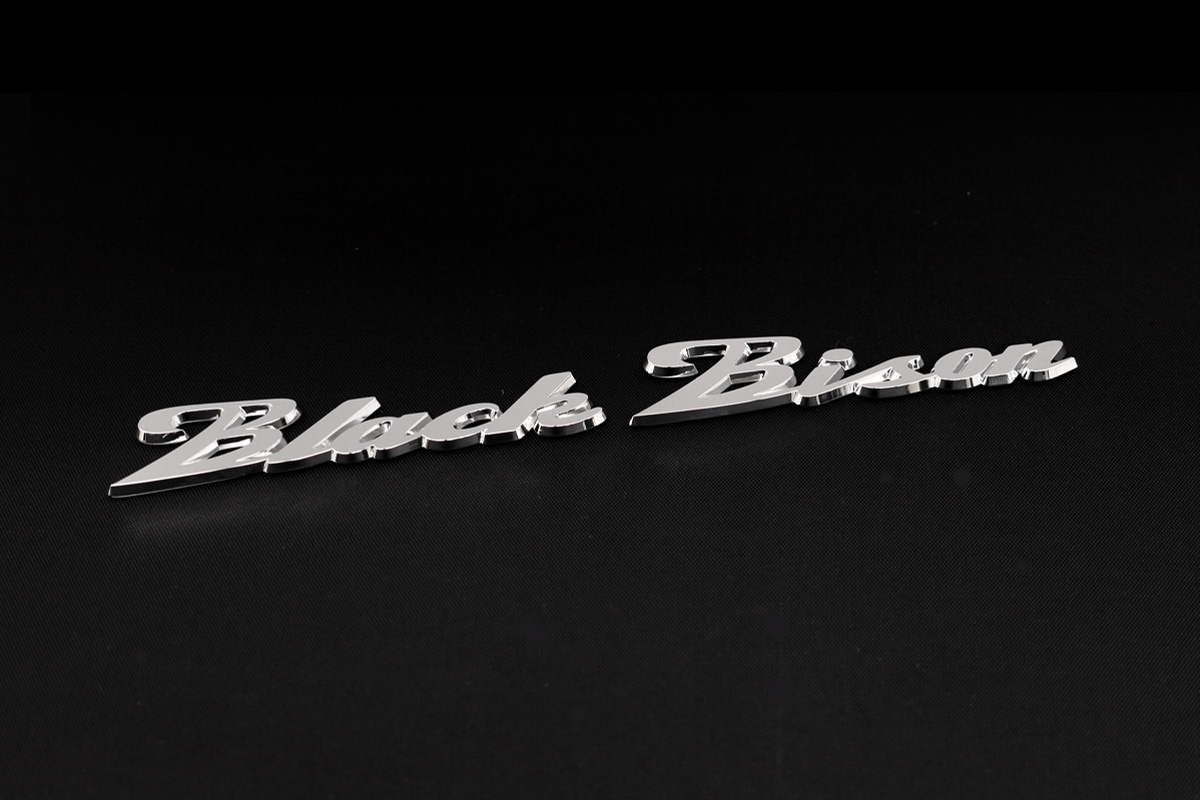 WALD Black Bison chrome script emblem shown on a black textured background