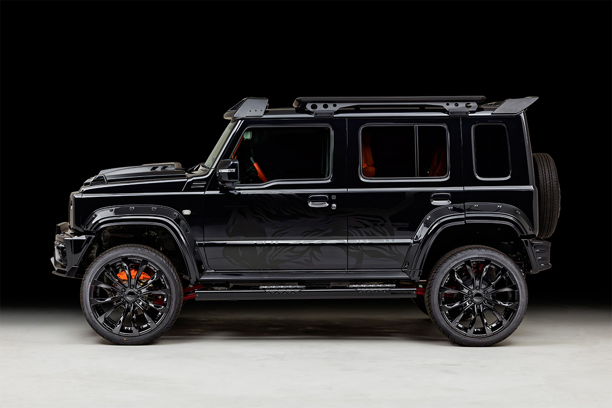WALD Black Bison Edition Suzuki Jimny Nomade JC74W — full side profile showing wide arch package, side steps, roof LED basement and rear wing