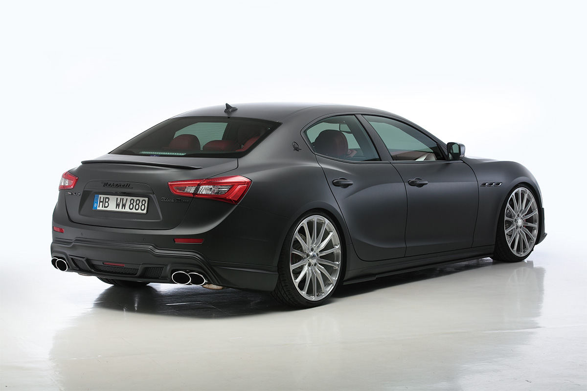 Maserati Ghibli 2013–2017 WALD Black Bison Edition — rear three-quarter view with WALD rear bumper spoiler and twin exhaust tips