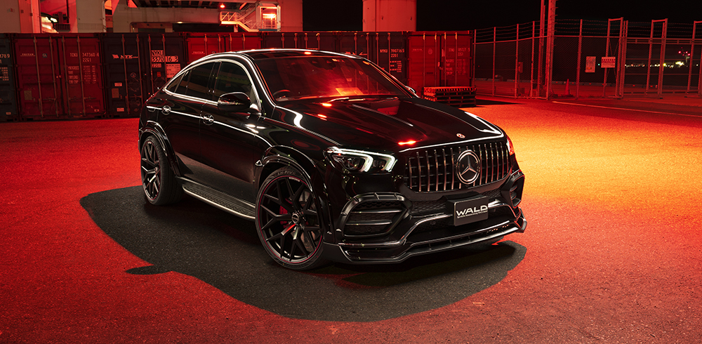 WALD Black Bison Mercedes GLE Coupe C167 front three-quarter night view at industrial location with Panamericana grille