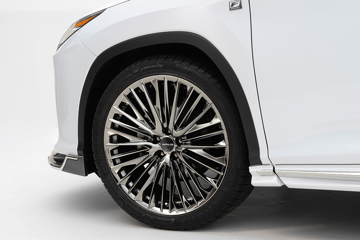 WALD Lexus RX450h F SPORT front wheel and side skirt detail with WALD stainless steel trim