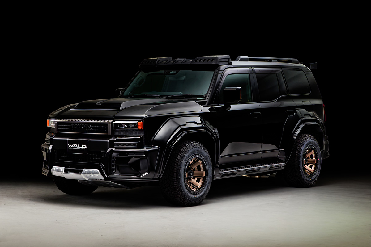 WALD Black Bison Land Cruiser 250 Prado studio front three-quarter view on 17-inch WALD wheels
