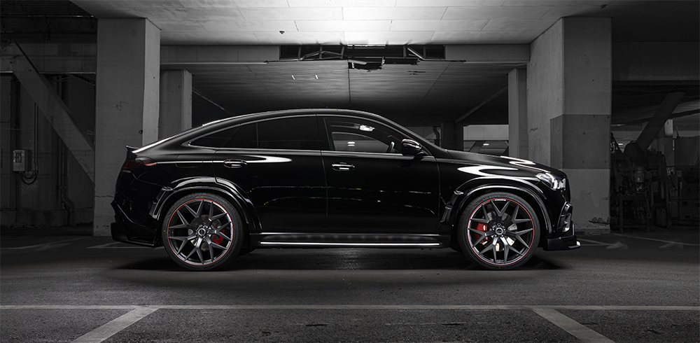 WALD Black Bison Mercedes GLE Coupe C167 side profile night view showing wide arch package and coupe silhouette