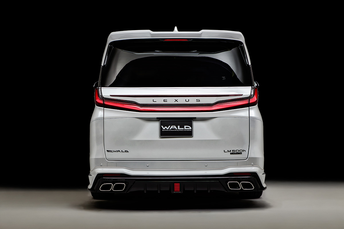 WALD Lexus LM500h rear view — WALD rear skirt with exhaust tips and rear wing