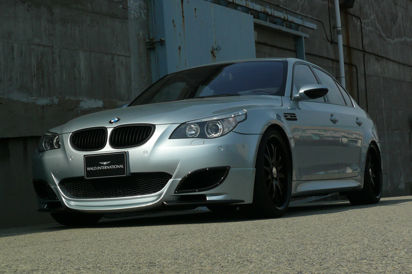 WALD BMW M5 body kit on location, silver BMW E60 M5 front three-quarter view