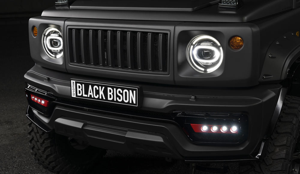 WALD Black Bison Edition Suzuki Jimny Sierra JB74W — close-up of the front bumper spoiler with LEDSL10P LED lamp units and Japamericana grill