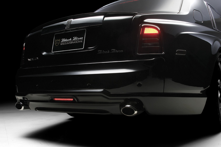 WALD Black Bison Rolls-Royce Phantom 7 Series I rear bumper spoiler detail with LED lamp and exhaust tips