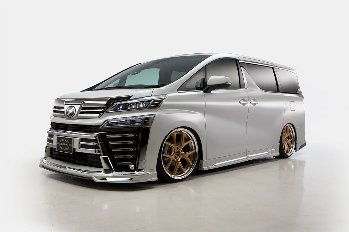 Silver Toyota Vellfire with WALD Executive Line kit on bronze ILLIMA I 12F forged wheels