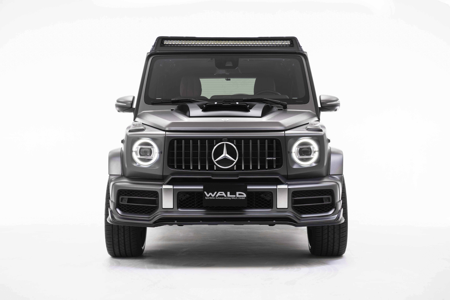 WALD Sports Line Mercedes G63 W463A front studio view with bonnet scoop, illuminated roof LED light bar and ABS front spoiler