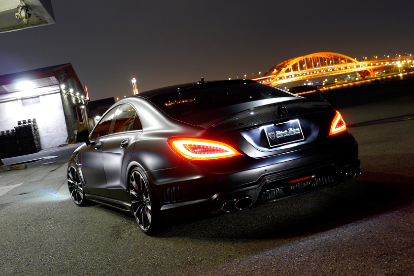 WALD Mercedes-Benz CLS C218 rear view at night with illuminated LED tail lamps and WALD quad exhaust system
