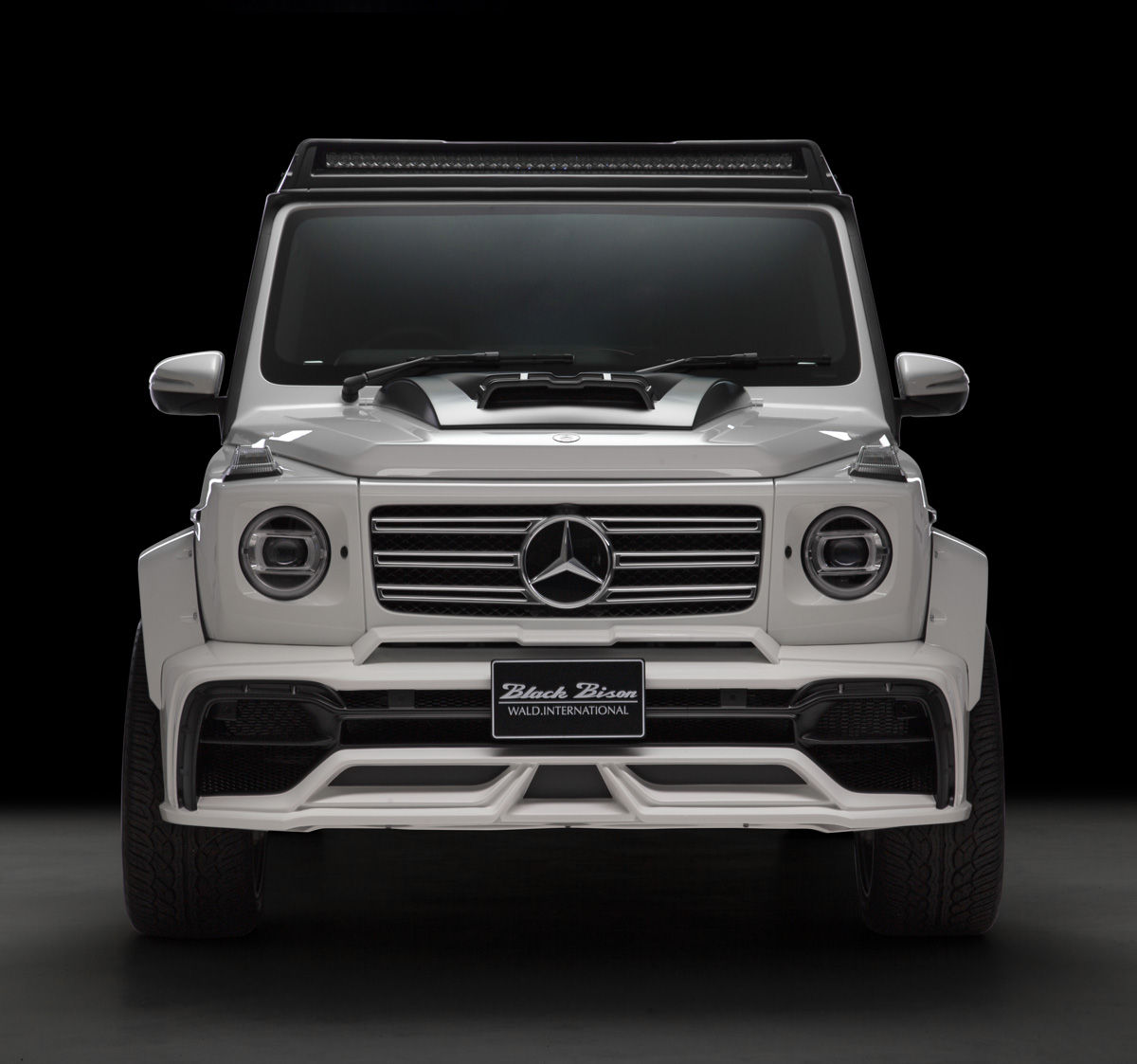 WALD G-Class W463A Black Bison head-on front view — white G-Class with front bumper spoiler, bonnet scoop and front roof spoiler
