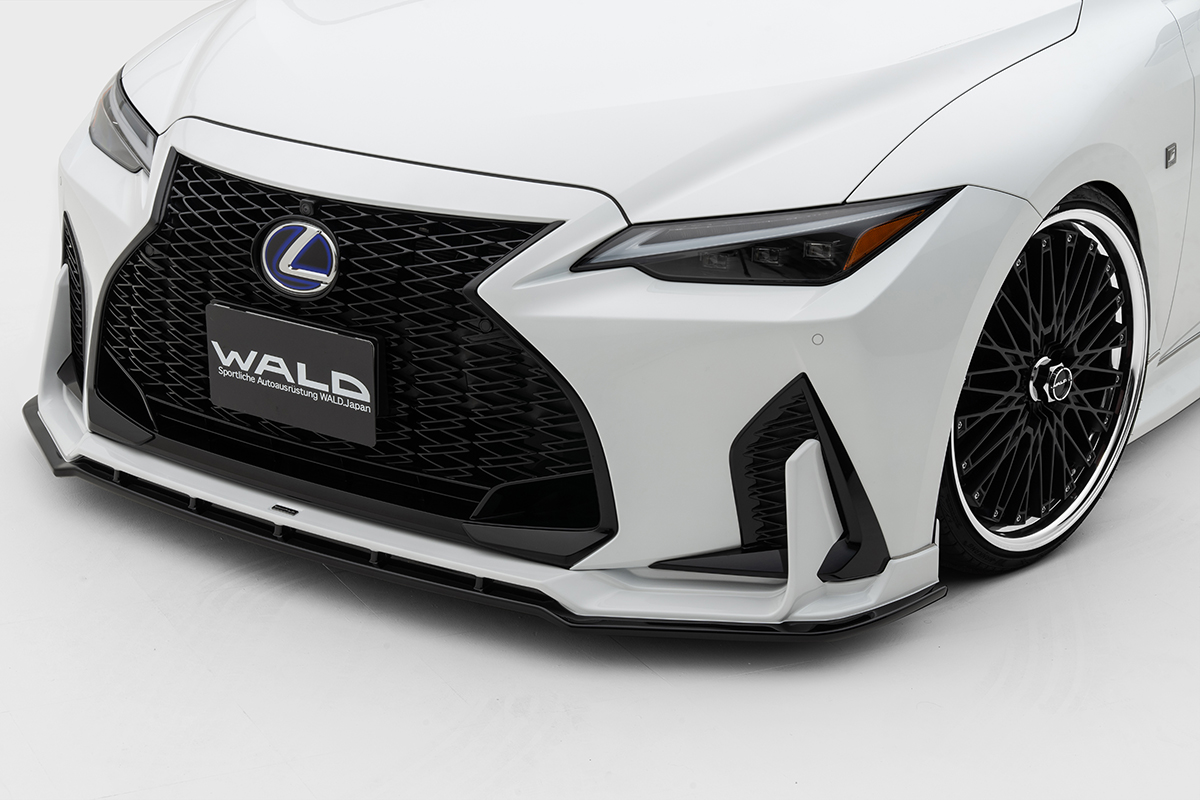 WALD Lexus IS front spoiler detail — vertical fins, lower lip and grille close-up