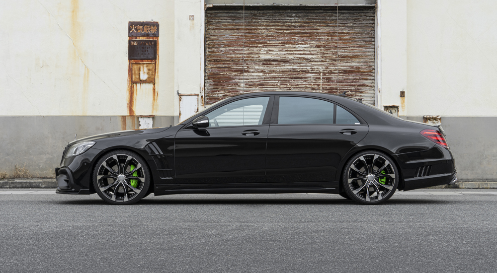 Full side profile of black WALD Black Bison Mercedes-Benz S-Class W222 with side skirts and forged wheels