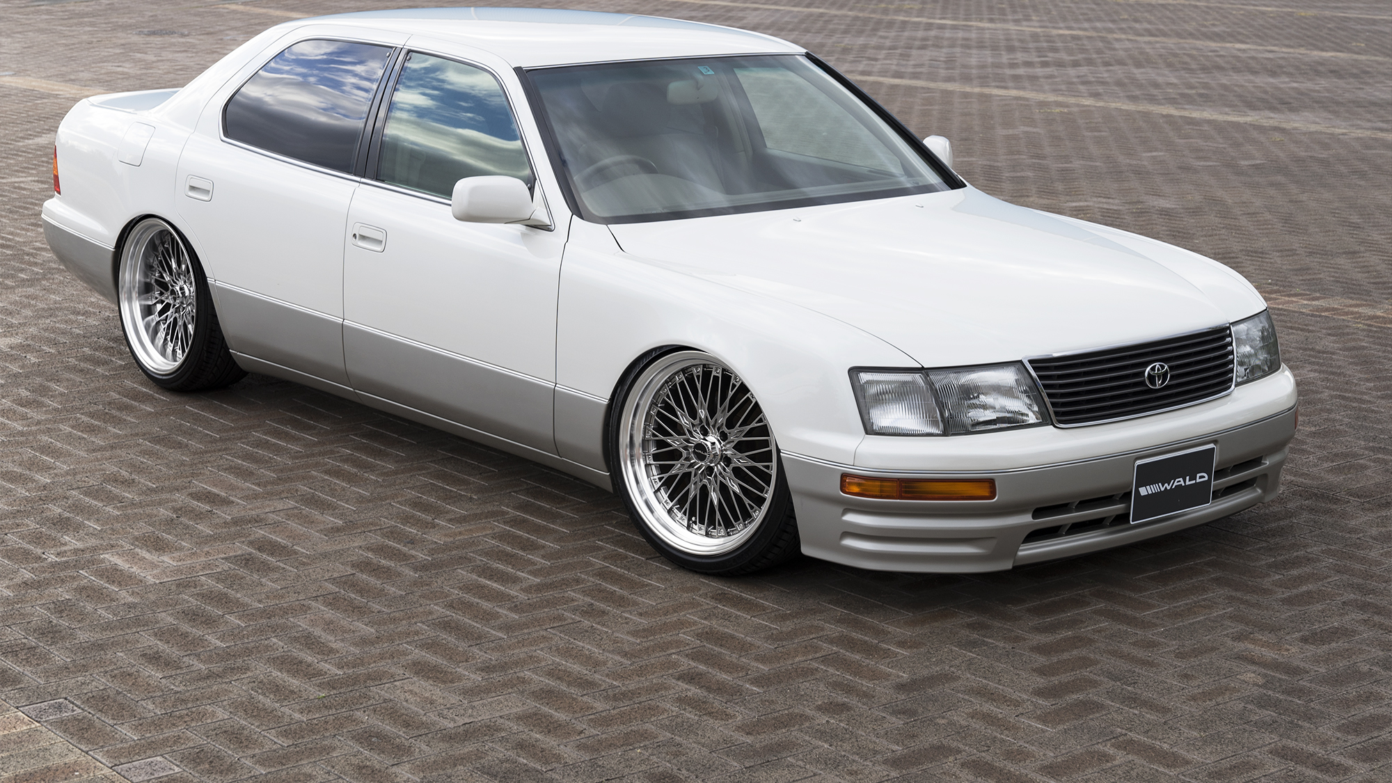 White Toyota Celsior UCF20 on polished WALD Classic Mesh CM12C wheels
