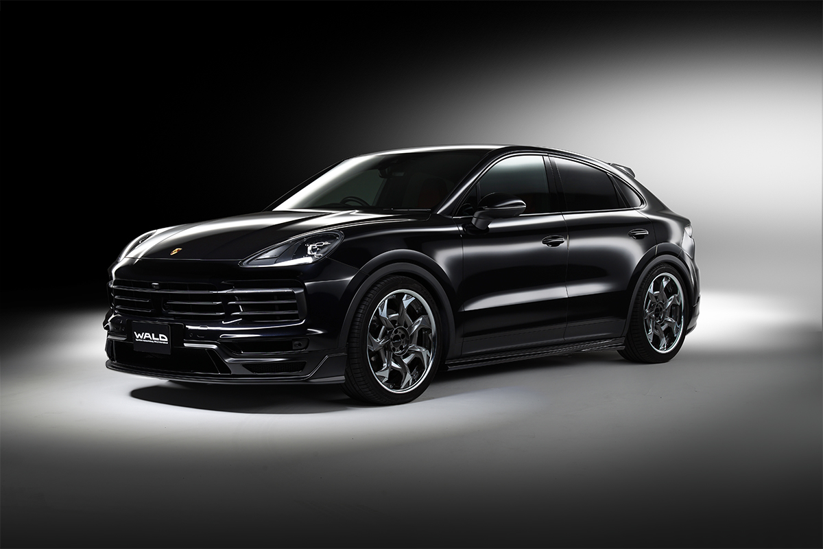 WALD Porsche Cayenne Coupe 9YA Black Bison Edition — black Cayenne Coupe front three-quarter view with WALD front spoiler and side skirts
