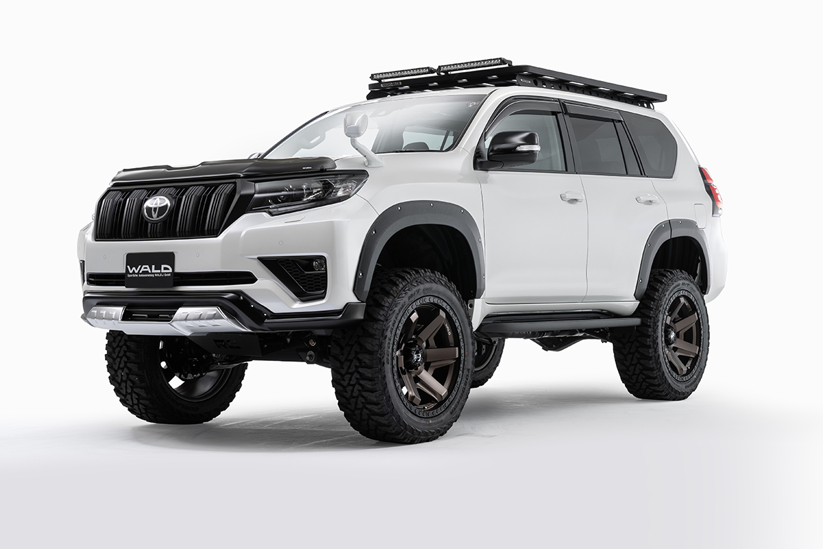 WALD Desert Line Land Cruiser Prado TRJ150W studio front three-quarter view with roof rack and LED light bars