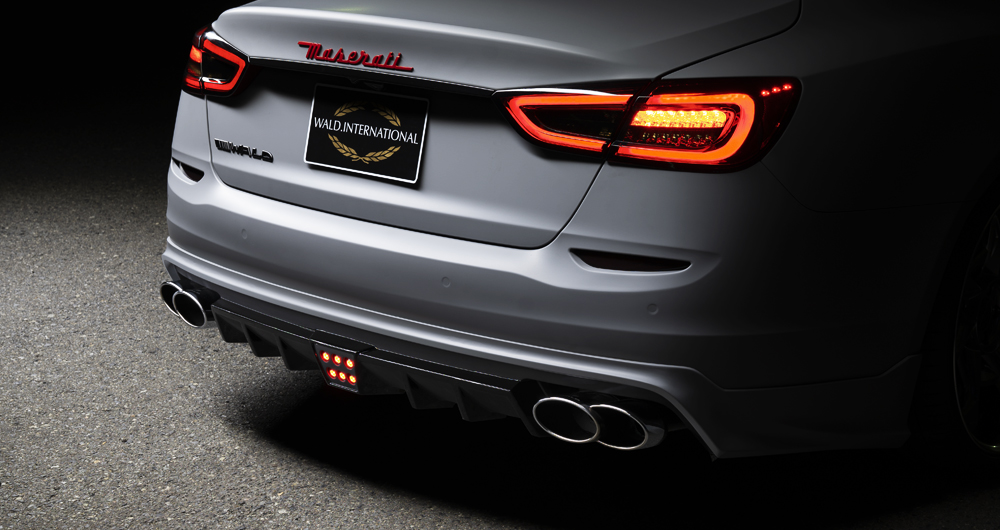 Maserati Quattroporte WALD Executive Line rear detail — rear skirt LED lamp and stainless steel exhaust tips