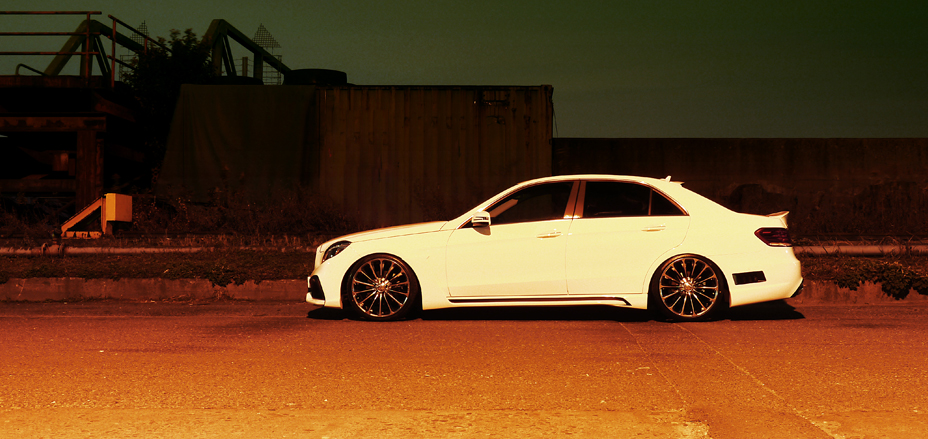 WALD Mercedes-Benz E-Class W212 full side profile showing side skirts, boot spoiler and multi-spoke wheels