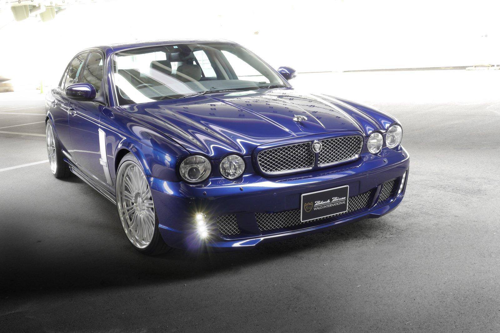 WALD Black Bison Jaguar XJ X350 in dark blue — front three-quarter view with mesh grille and LED fog lamps