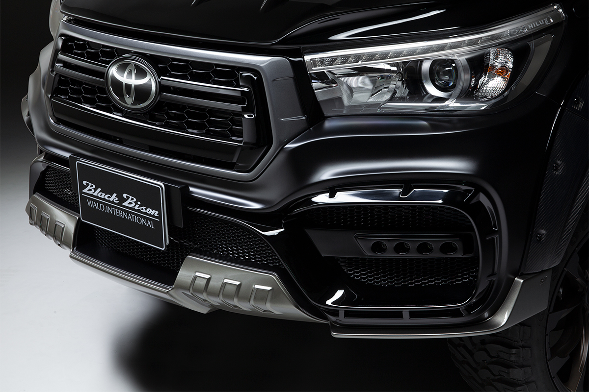 Detail of the WALD Black Bison front bumper spoiler and licence plate holder on the Toyota Hilux GUN125