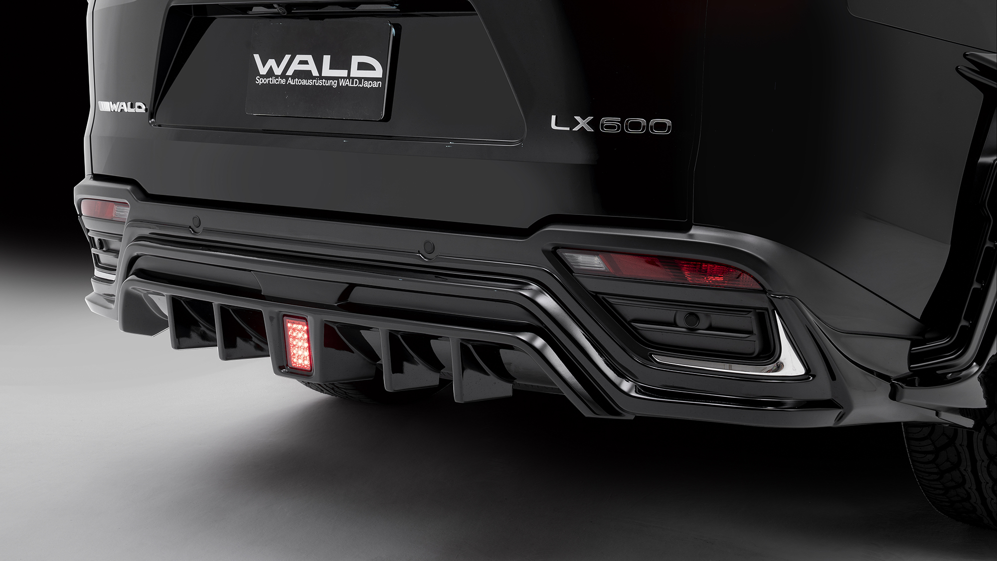 WALD Lexus LX600 rear skirt detail — ABS rear skirt with diffuser fins and rear skirt LED lamp